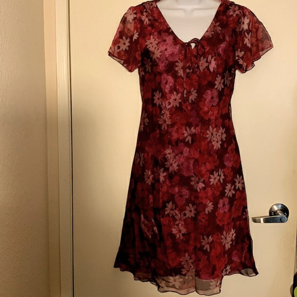Cute flower dress in shades of maroon and purple.